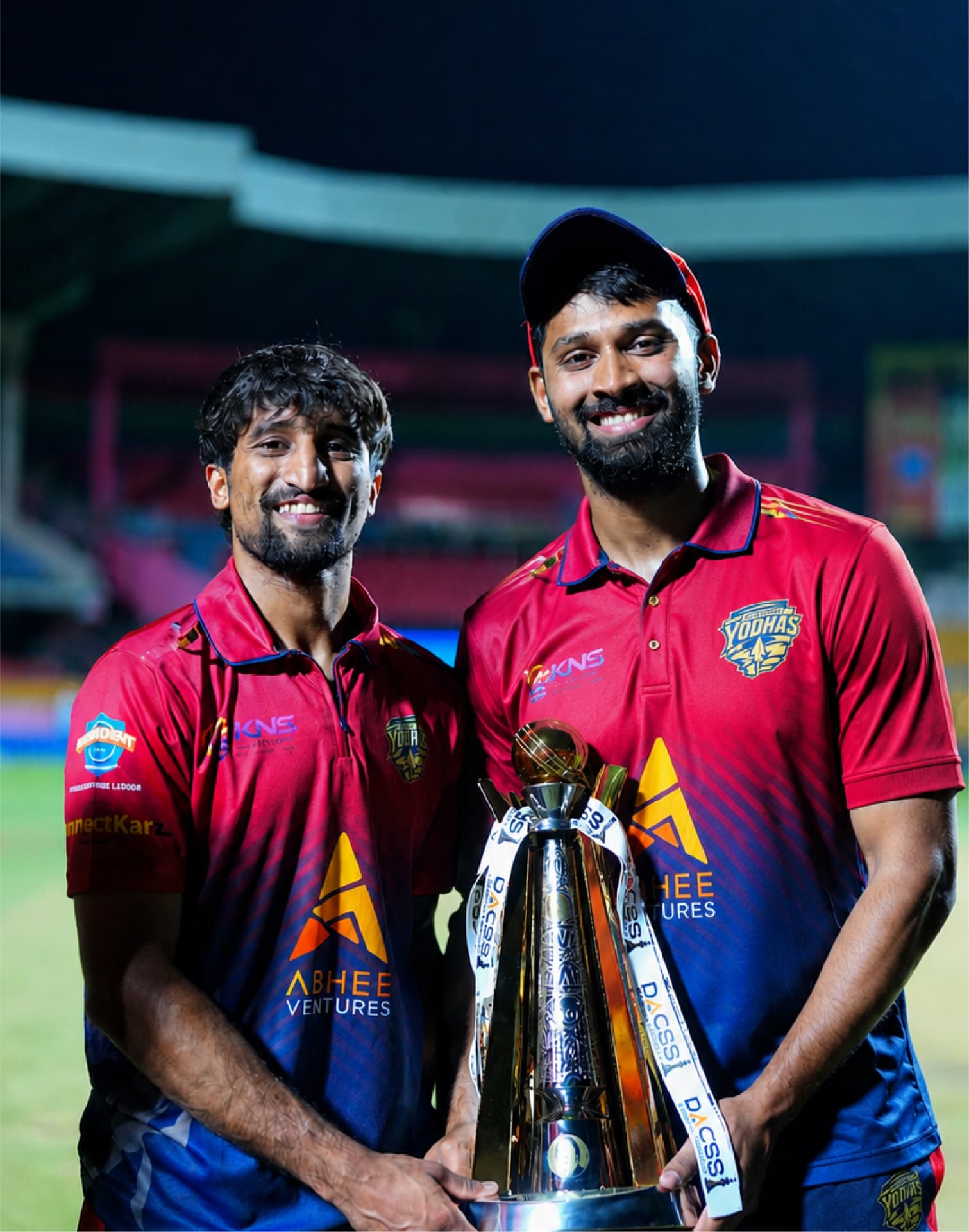 Shivamogga Yodhas players holding the Maharaja Trophy